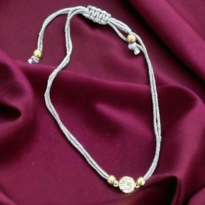 Grey string bracelet